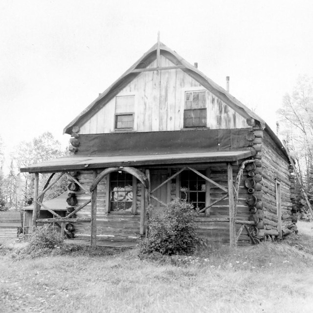 log cabin with arched entryway