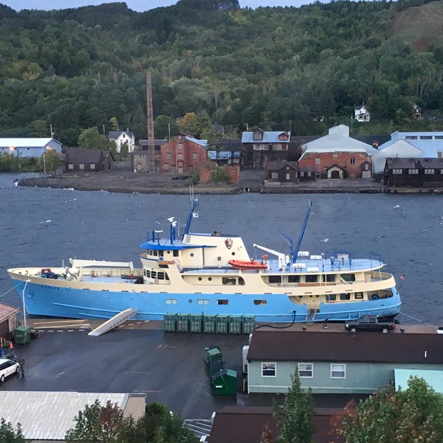 RANGER III passenger ferry at dock in Houghton Michigan as seem from a distance atop a hill. 