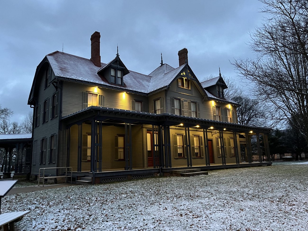 Front of Garfield home with snow on roof.
