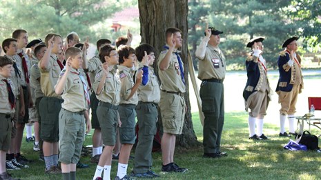 Group of scouts standing outside at a merit badge program.
