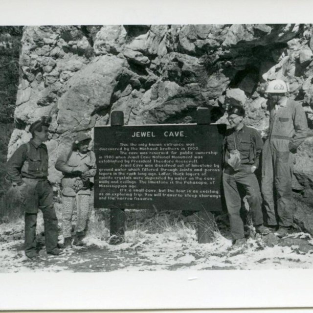 Photo of the Michaud's on the front porch of there lodge.