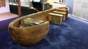 Dugout canoe in the museum that can accommodate a wheelchair within the canoe