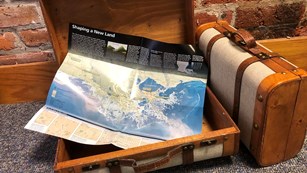 Suitcases and map of Louisiana coast