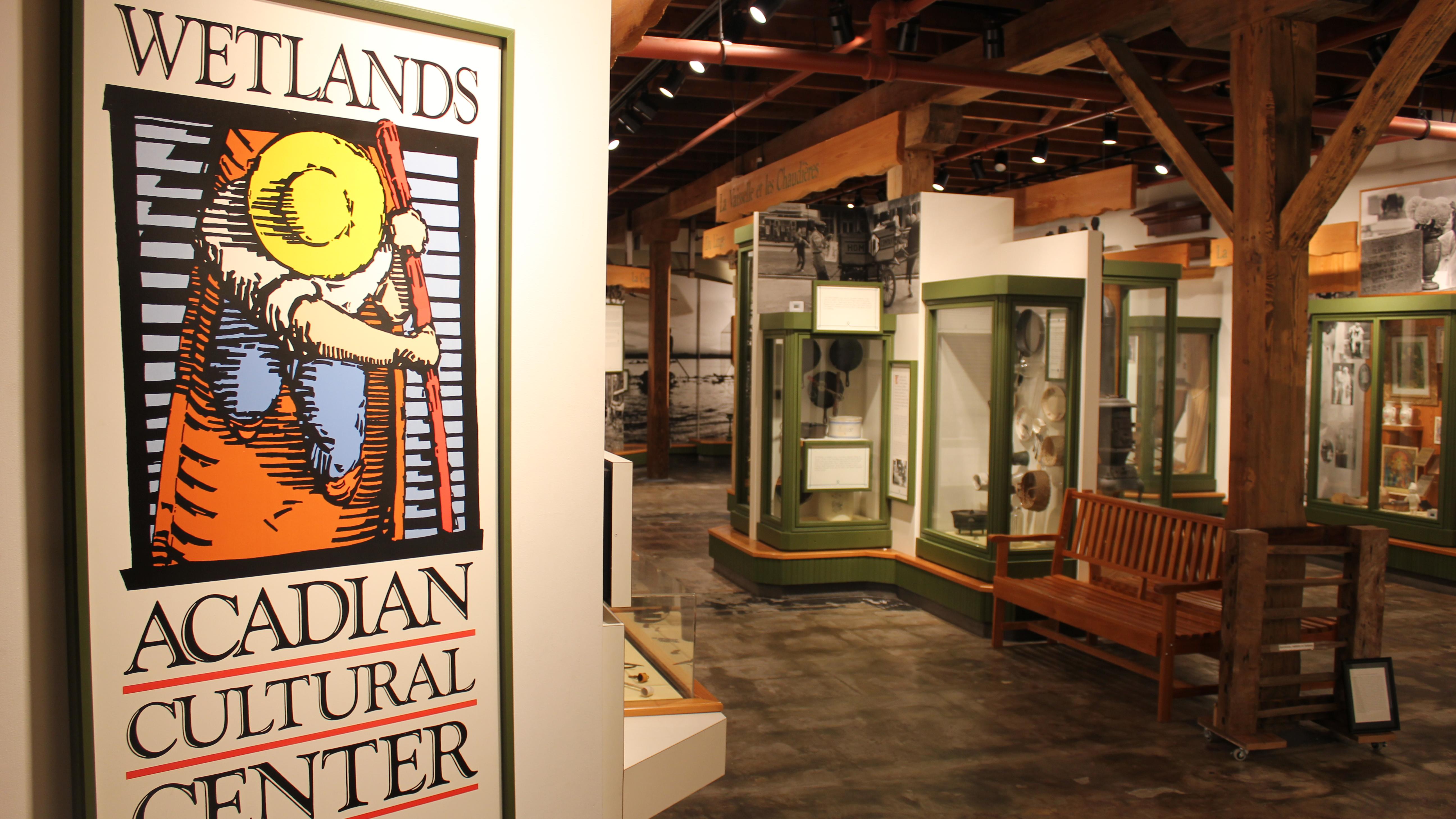 museum entrance sign with display cases in distance