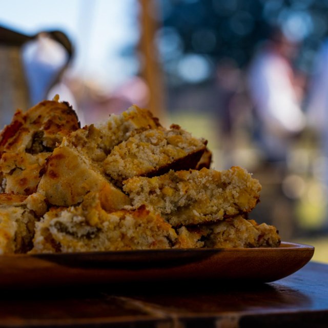 A stack of cornbread on a plate.