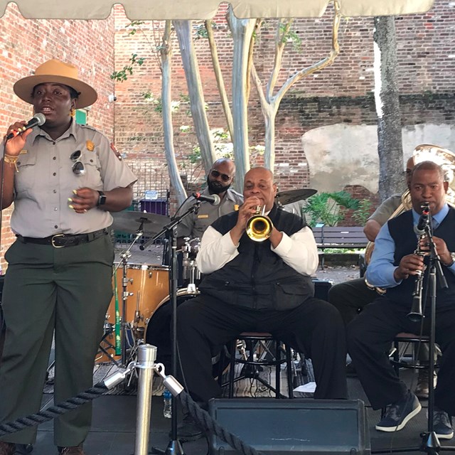 A ranger performs with a jazz band