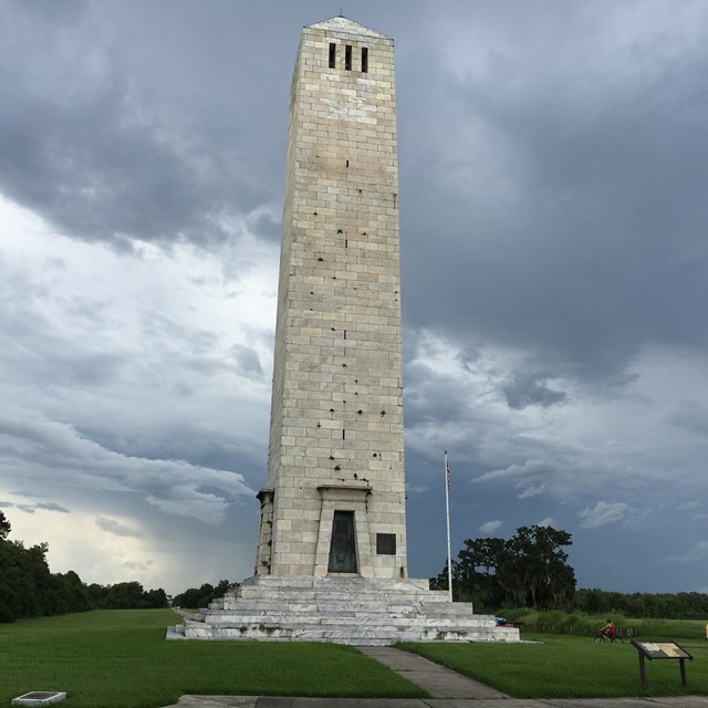 The Chalmette Monument on a cloudy day.