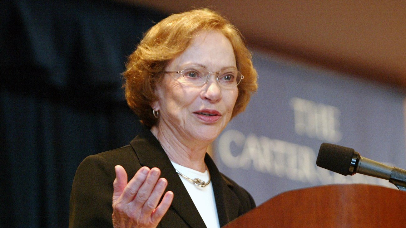 Rosalynn Carter at a lectern