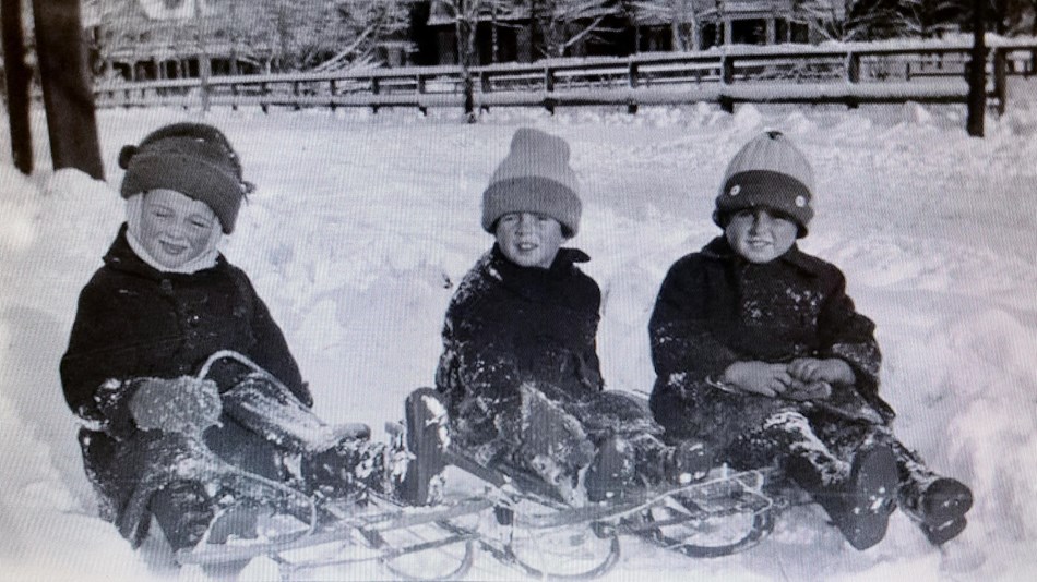 John and Joe Kennedy Jr sled in Brookline with a friend.