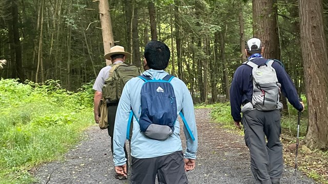 A park ranger guides hikes on a trail.