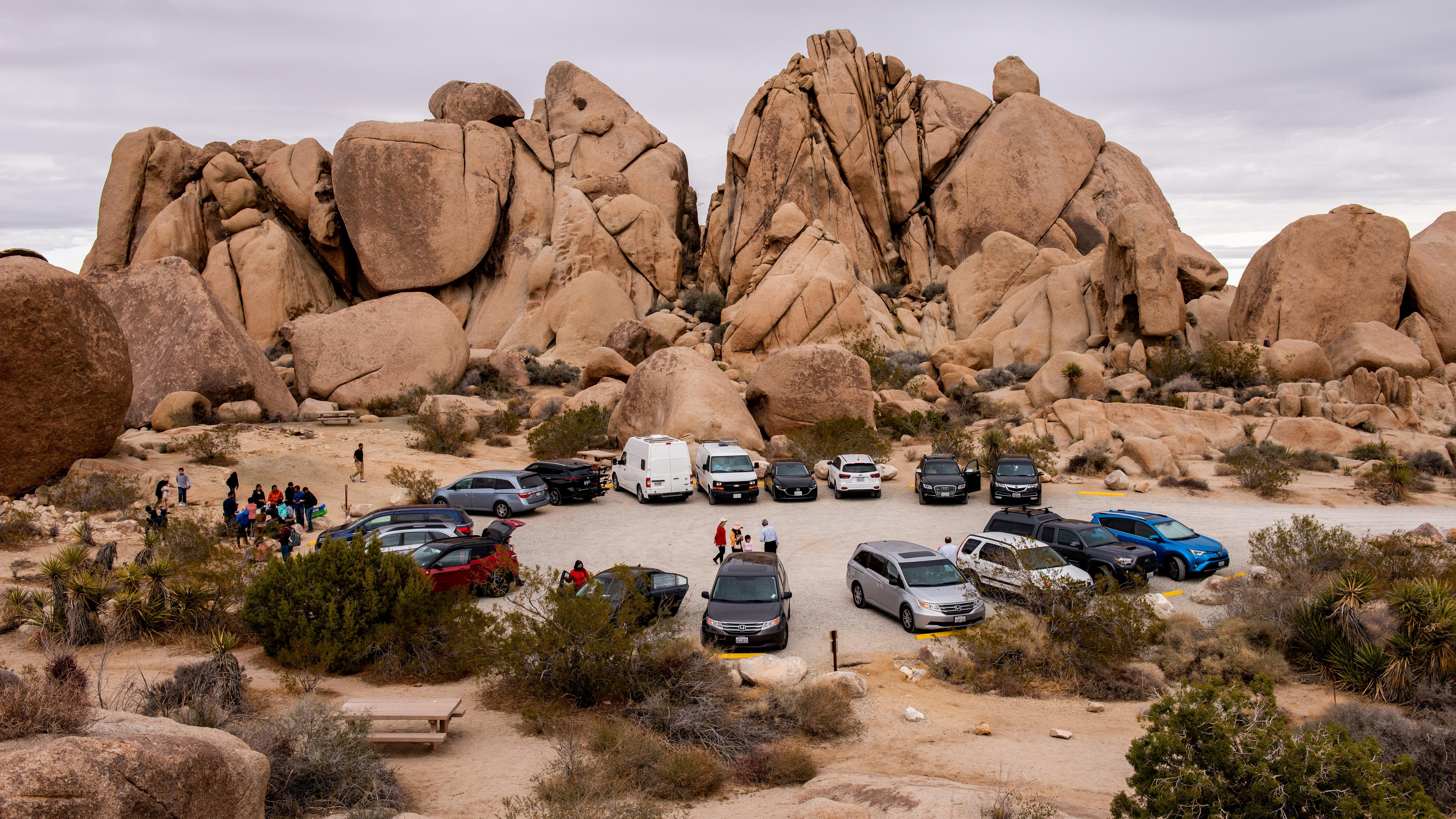 Busy parking lot with rocks formations