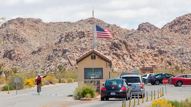 cars entering the national park through an entrance station