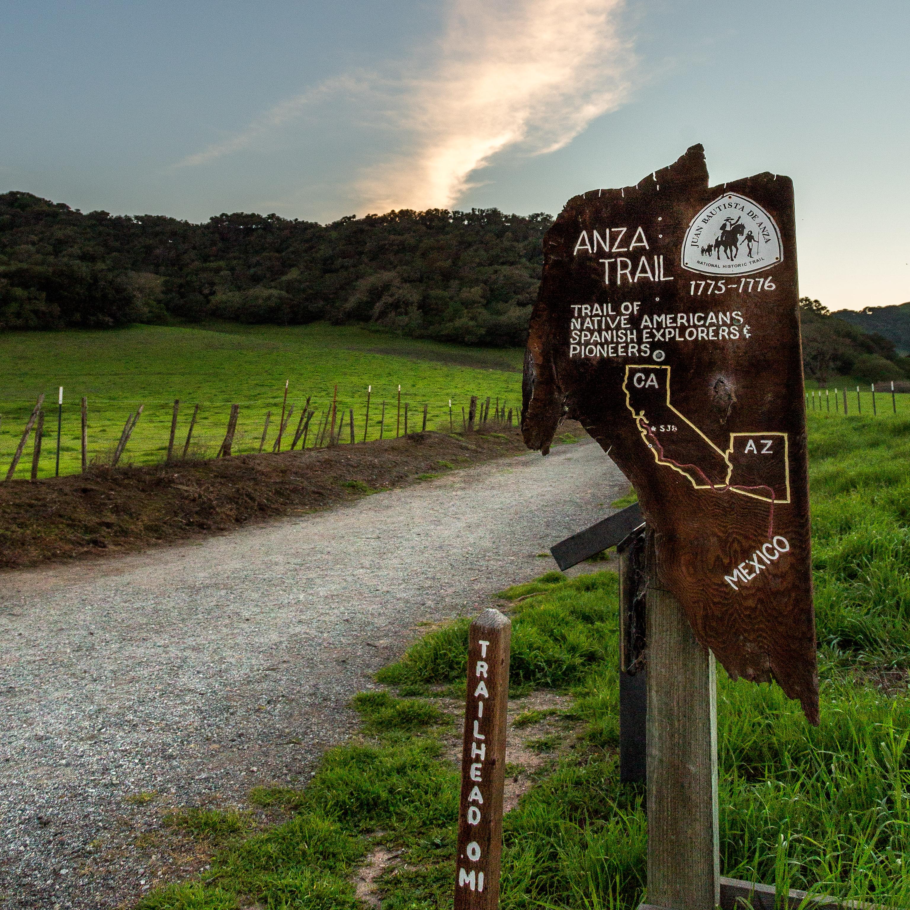 A sign post reading Anza Trail. Trail of Native Americans, Spanish Explorers, and Pioneers. 