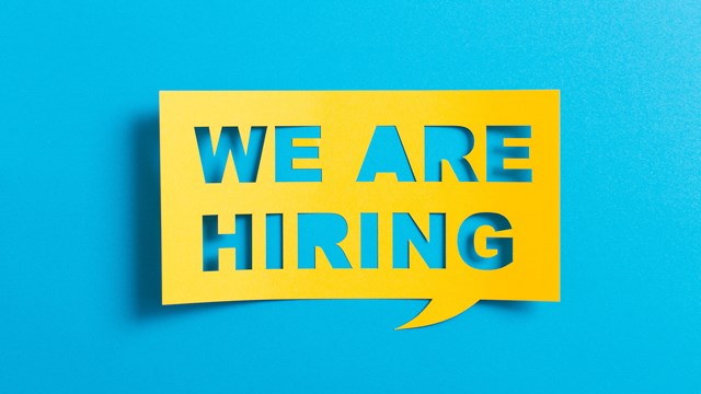 Yellow banner stating "We Are Hiring"