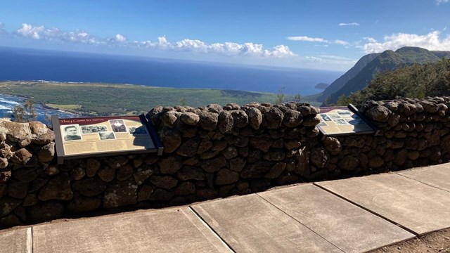 Two informational wayside signs at an overlook