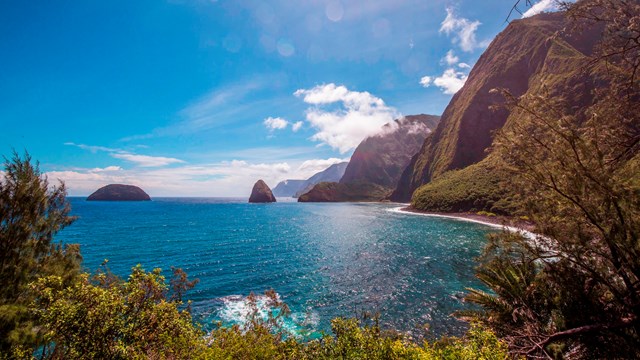 The ocean, two islands, and tall sea cliffs