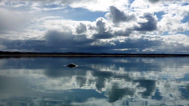 Clouds reflecting in Naknek River.