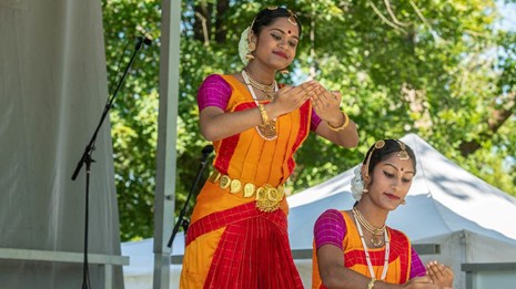 Two people perform a traditional dance