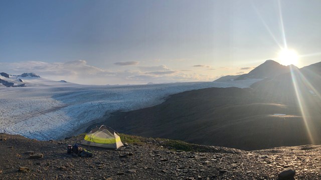 A tent with icefield beyond