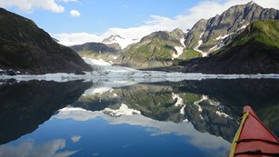 Kayaker viewing Pedersen Glacier