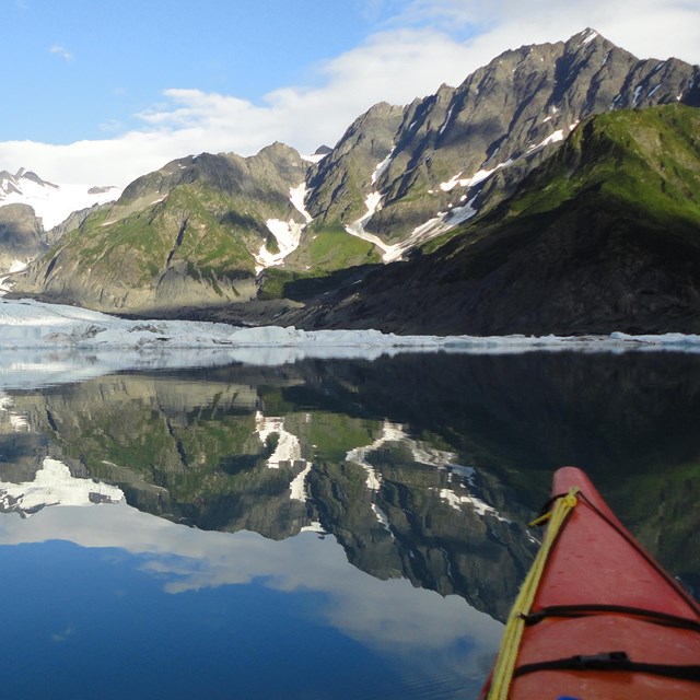 Kayaker viewing Pedersen Glacier