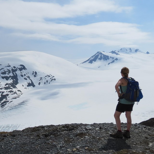 Woman looking over the Harding Icefield