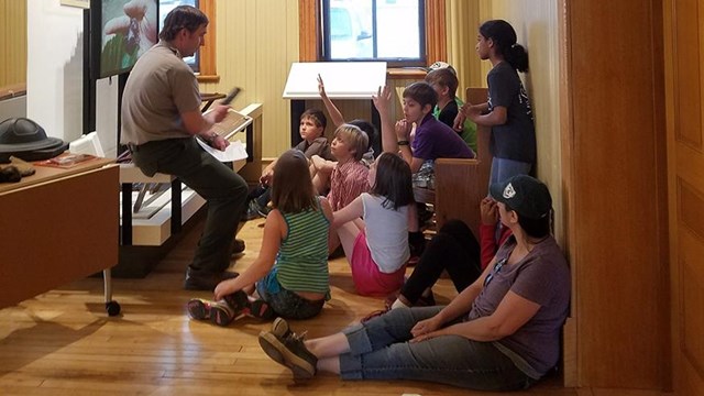 Park ranger with youth inside.