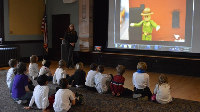 The Youth Historians kids group watches a movie on the third floor of the Calumet Visitor Center.