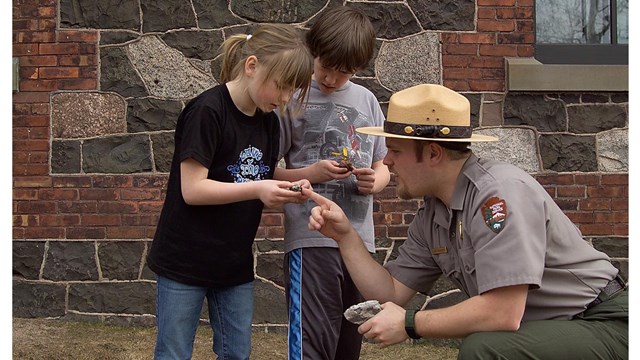 Park ranger with two children