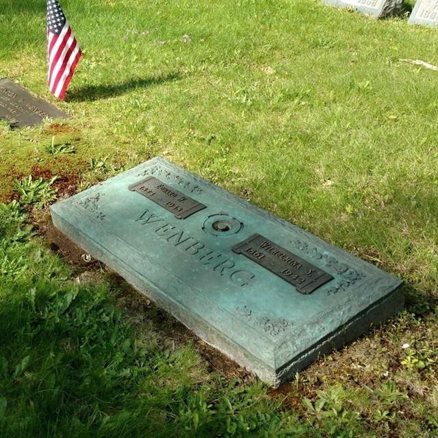 A collection of different sized grave markers in a cemetery.