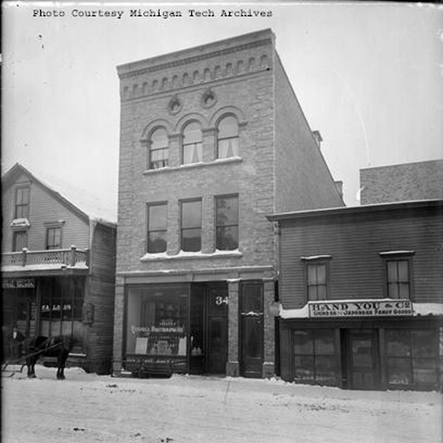 A historic buildings photo of commercial businesses in Calumet, MI