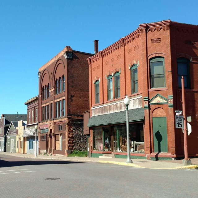 A line of buildings in an aged downtown area.