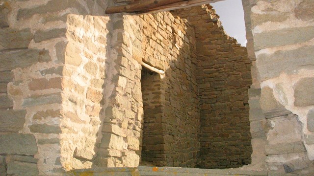 Window through the wall of a stone house.