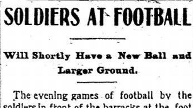 Newspaper headline reading "Soldiers at Football"