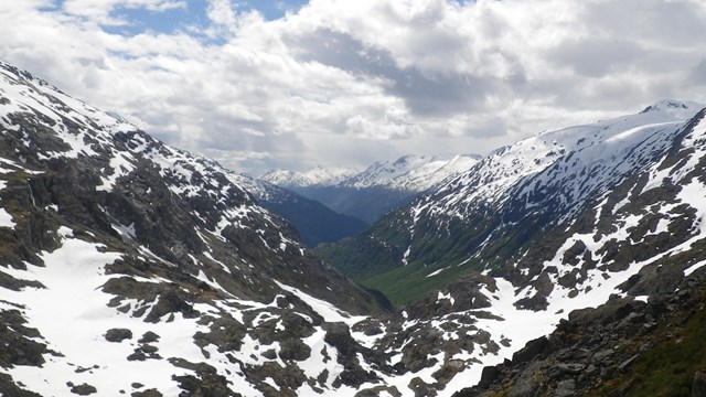 Mountain pass with some snow and blue sky