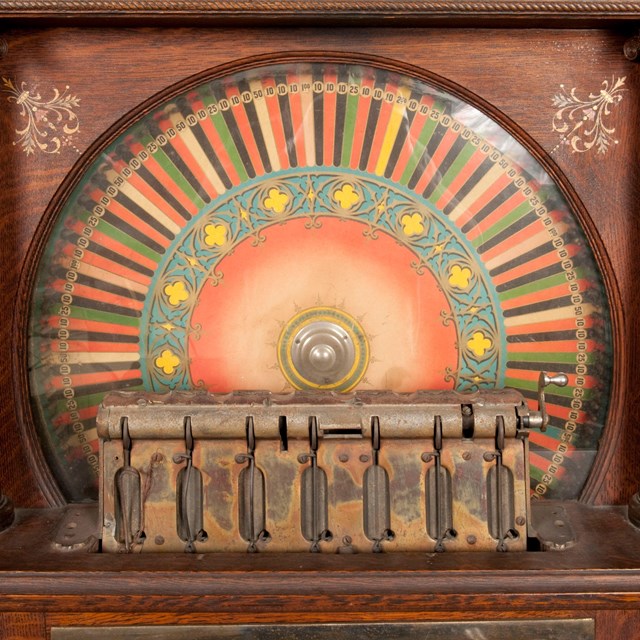 Brightly colored wheel in a wooden case
