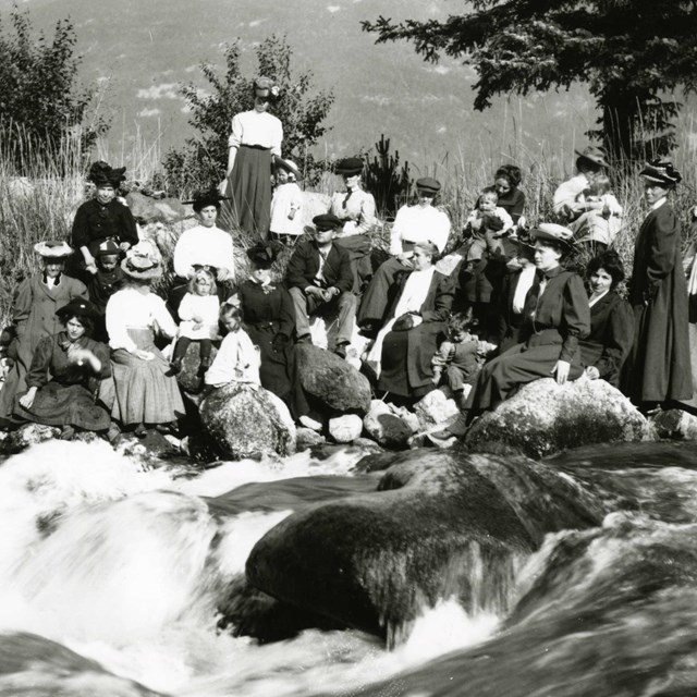 Ladies picnic along a river