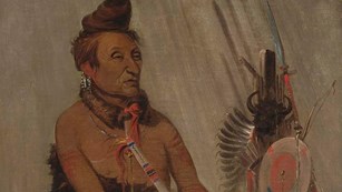 Hidatsa. A painting of a native american man in regalia.