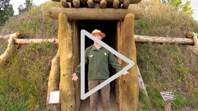 A thumbnail of a park ranger standing in front of an earthlodge.