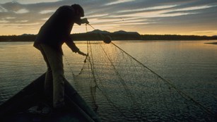 Inupiaq women pulling in gill net