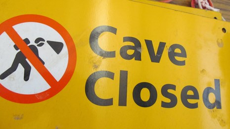 a cave closed sign