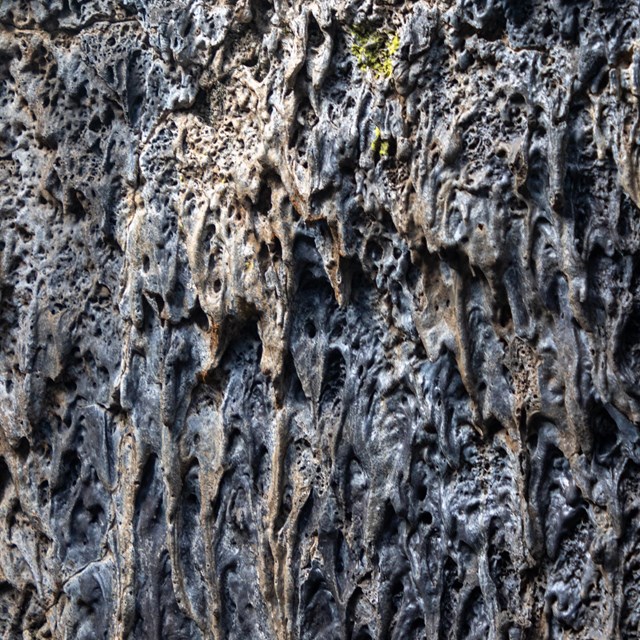 A wall of a lava tube with a rough texture
