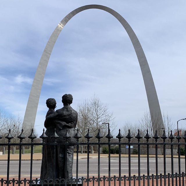 View of the Dred and Harriet Scott Sculpture facing the Gateway Arch