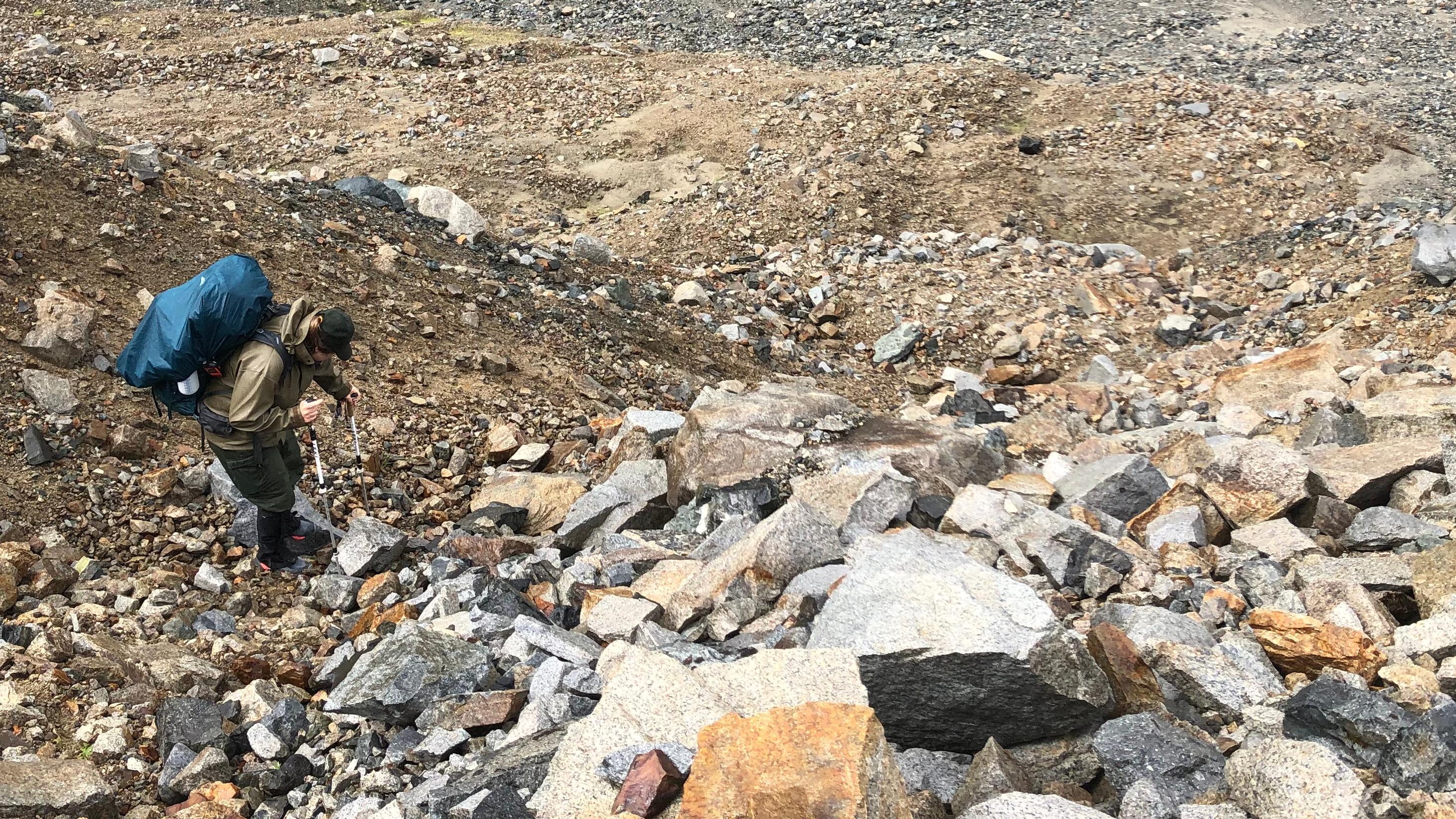 Image of backpacker on rocky terrain