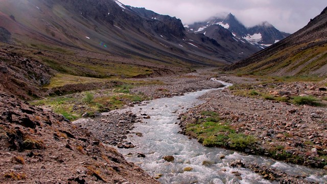 A river in a a steep mountain valley