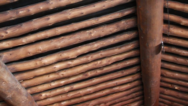 The wooden ceiling of a log cabin
