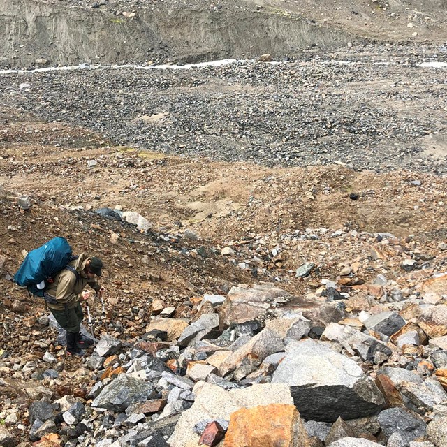 Image of backpacker on rocky terrain