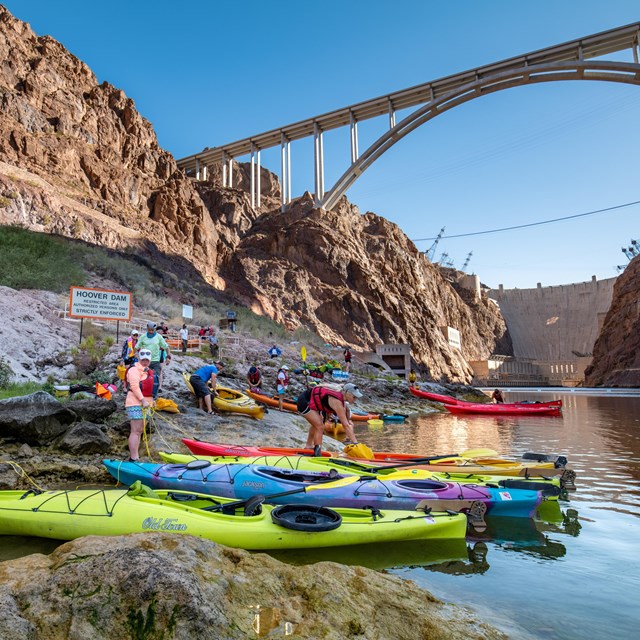 Kayakers in front of the Hoover Dam.