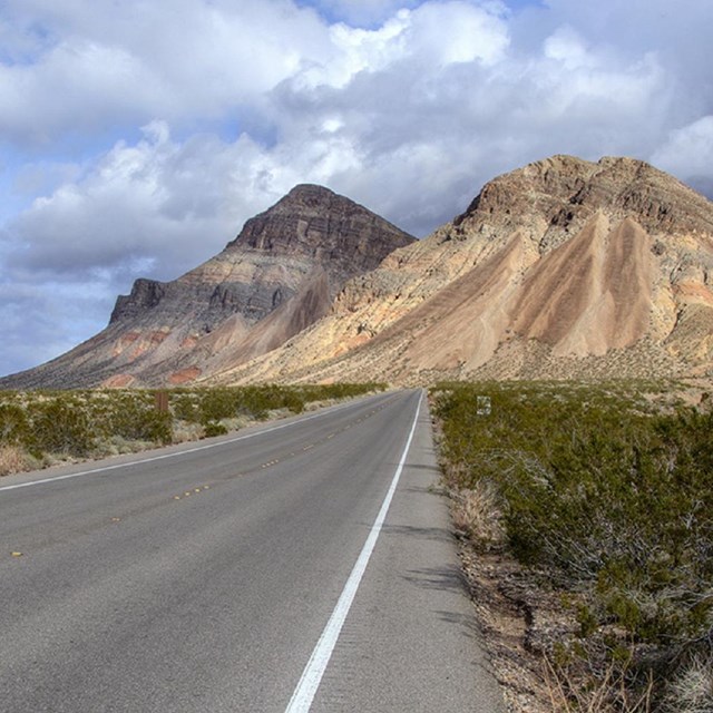 Road with view of mountains in background.