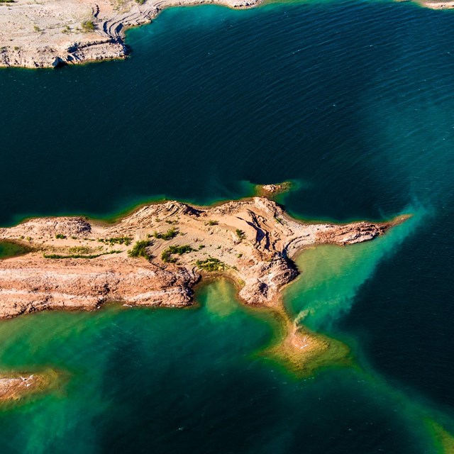 Aerial view of the river with desert landscaping. 